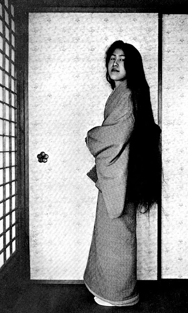 A Geisha Poses for a Photo After Washing Her Hair, and Before Styling It, ca. 1910