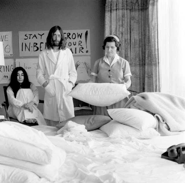 John Lennon and Yoko Ono Waiting for Maid to Make Bed During “Bed-In for Peace” in 1969